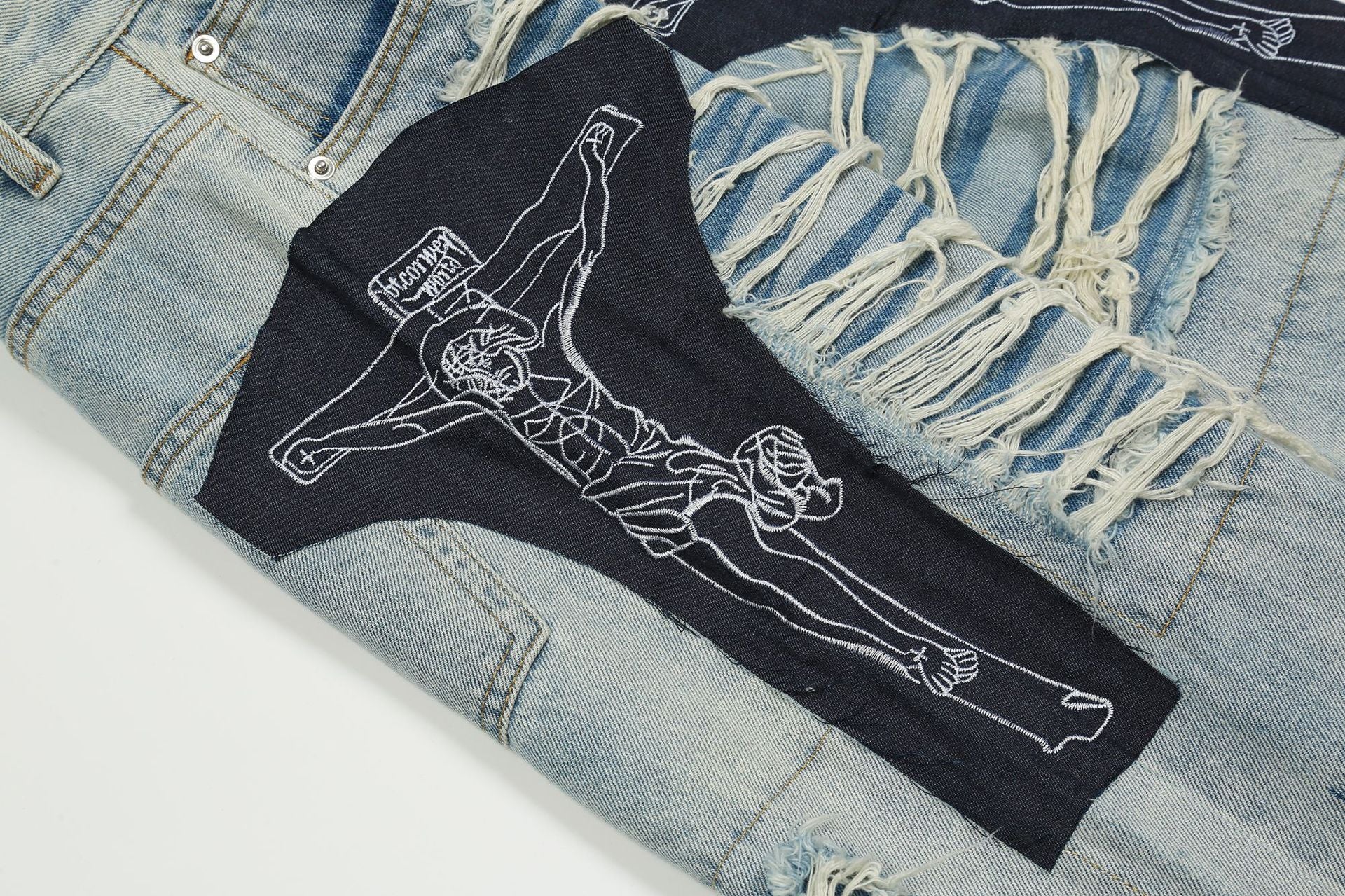 Jean patchwork déchiré à motif Jésus