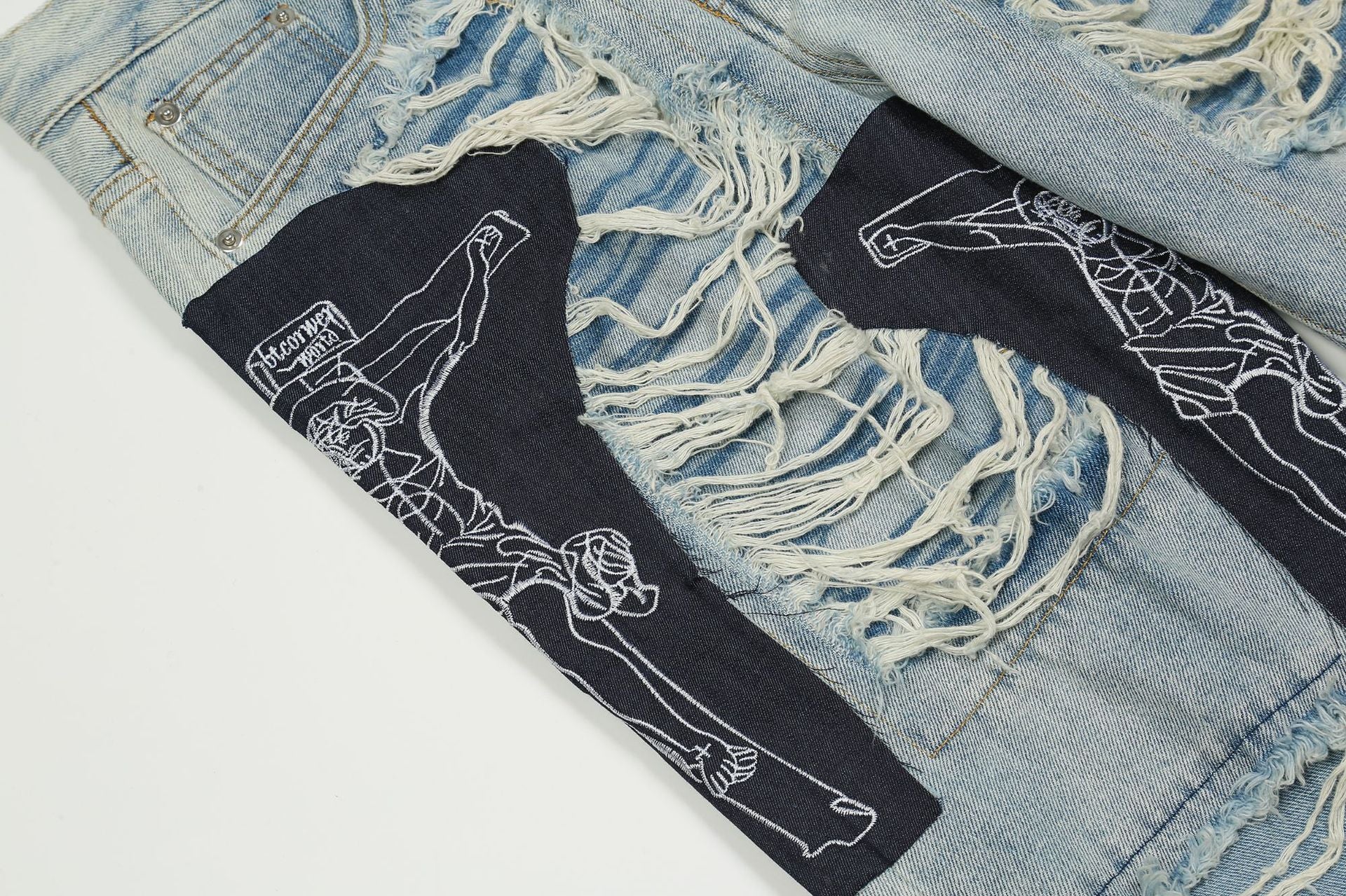 Jean patchwork déchiré à motif Jésus