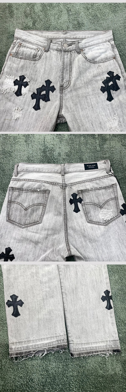 Jeans mit überkreuzten Rissen